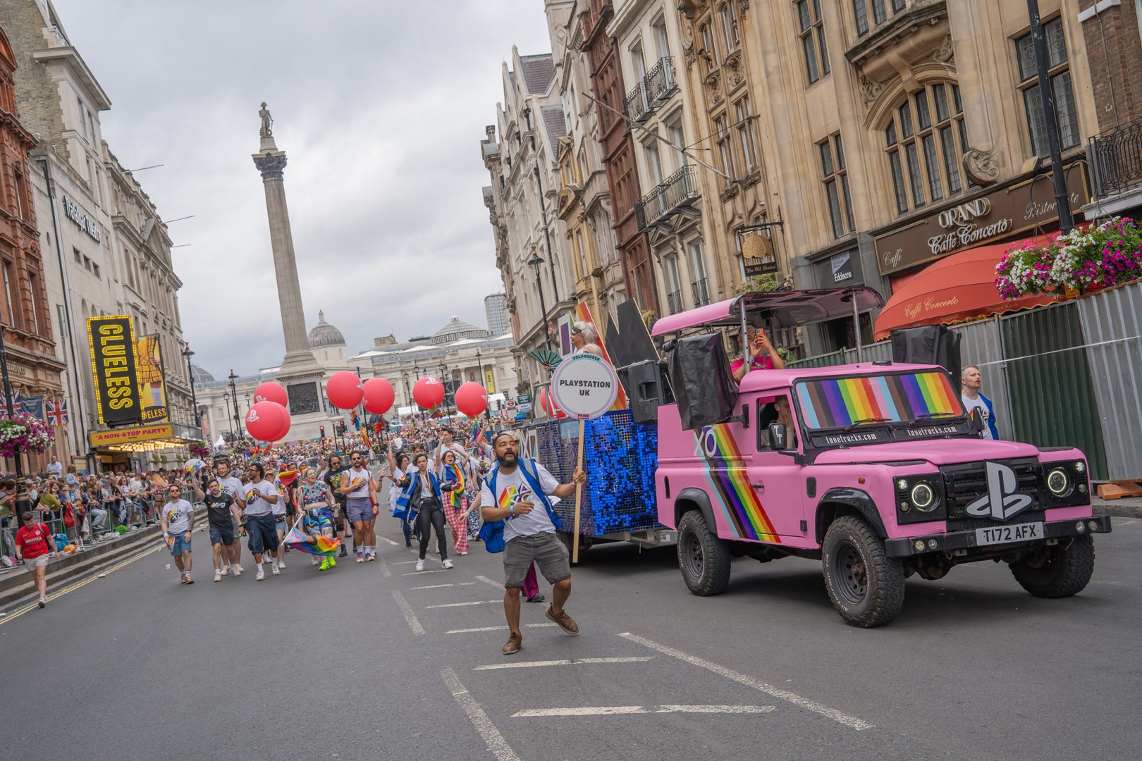 A group photo of London Sony Interactive employees walking at the London Pride parade.