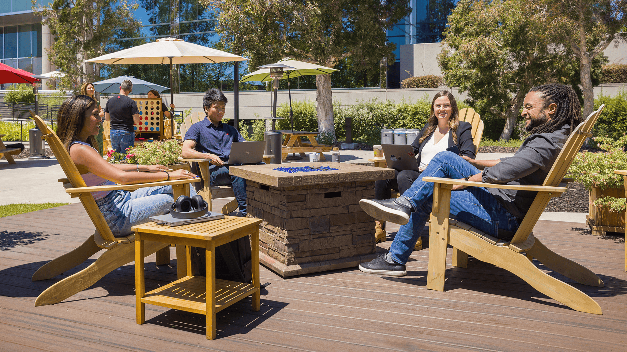 Group of Sony Interactive employees conversing outside the office