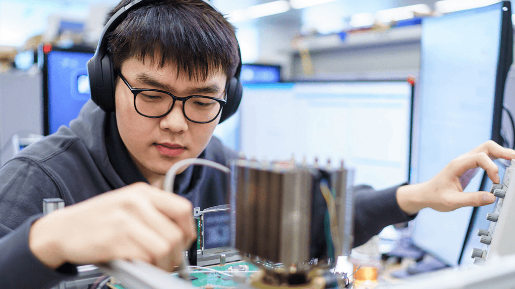 Engineer tinkering on a circuit board