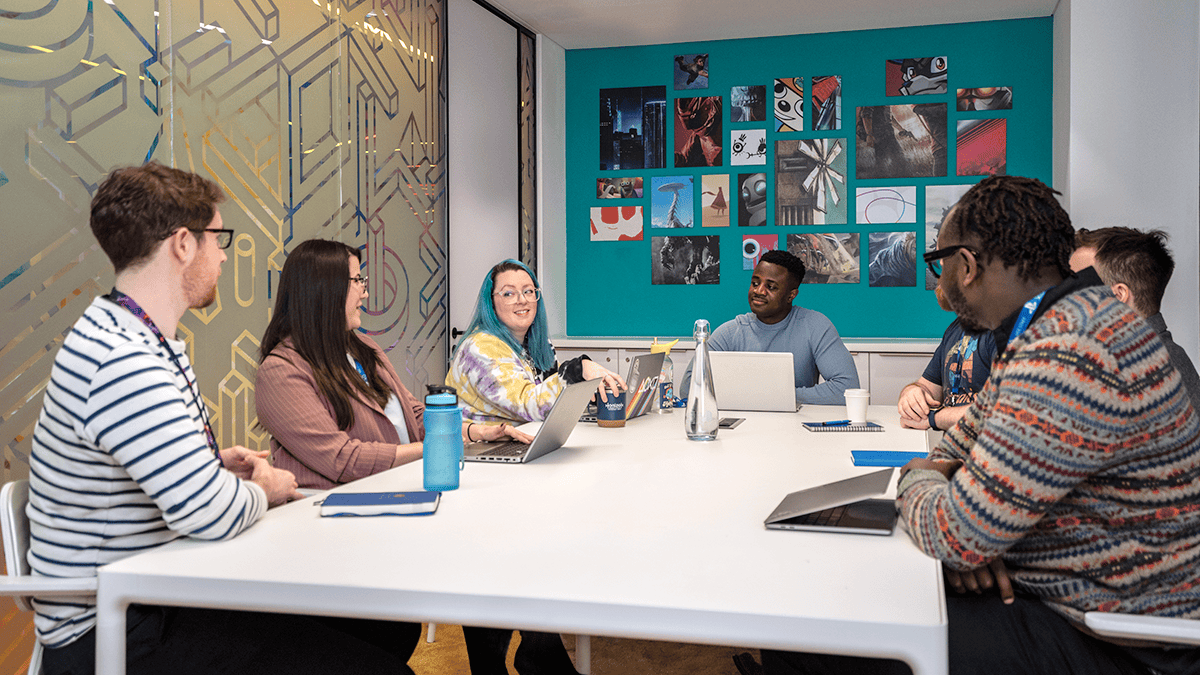 PlayStation employees in a meeting in a conference room
