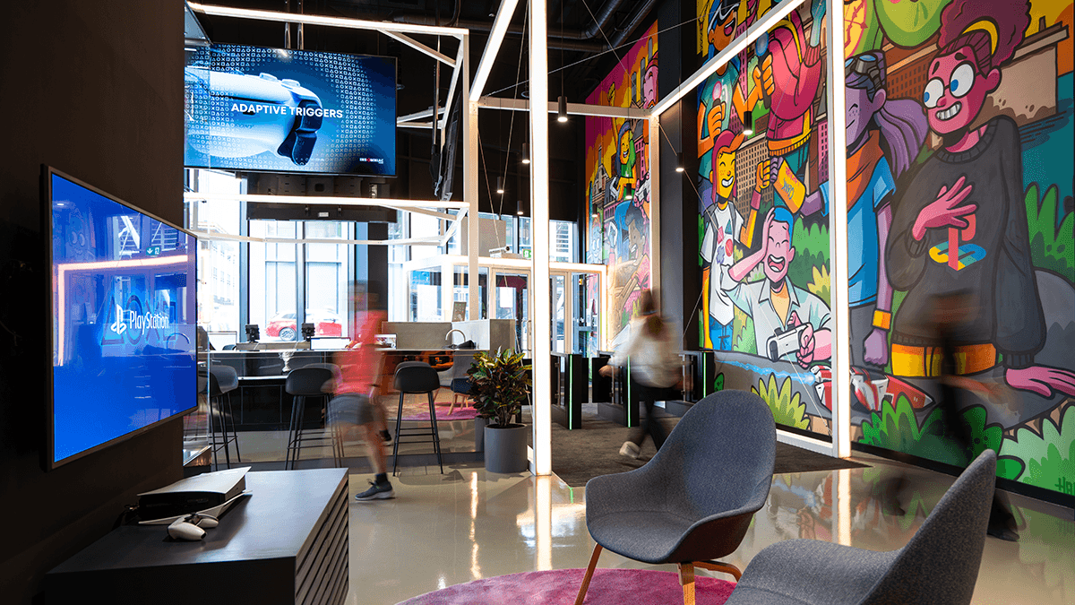 Inside a PlayStation office with a colorful mural