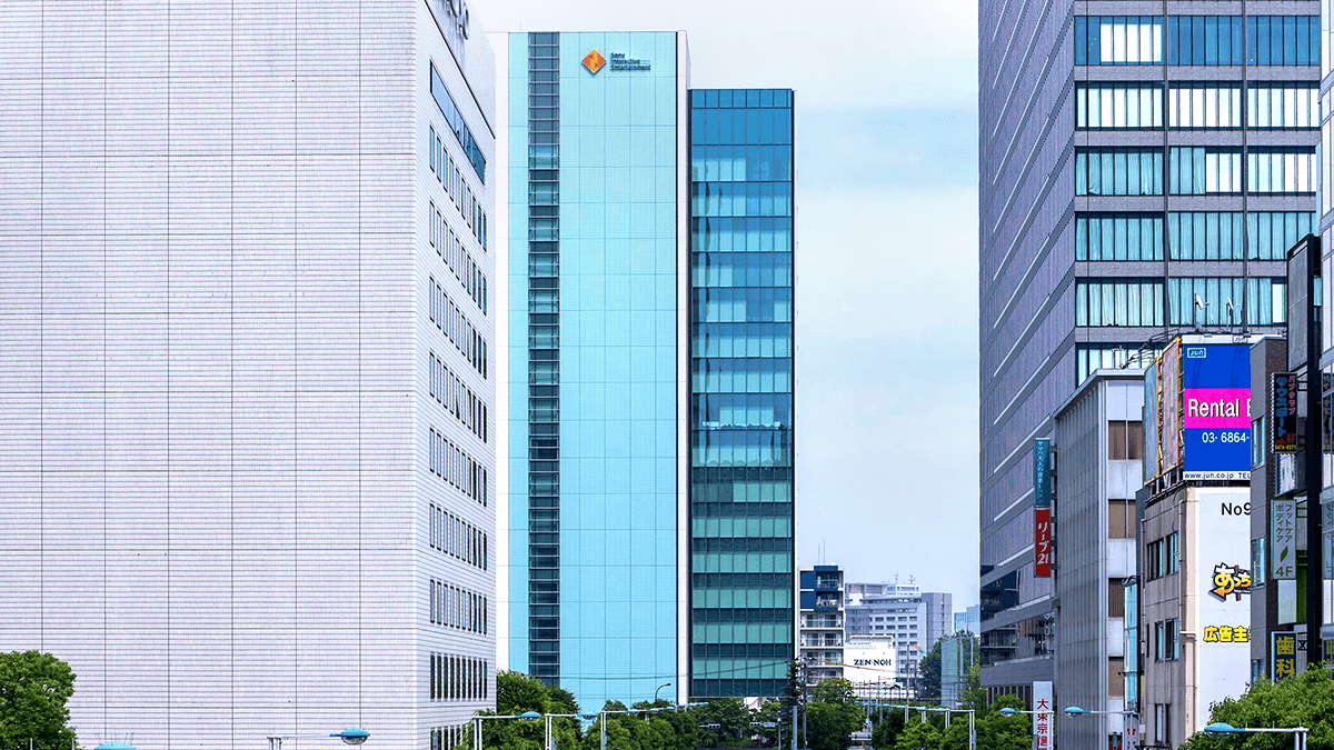 City street lined with modern high-rise office buildings.